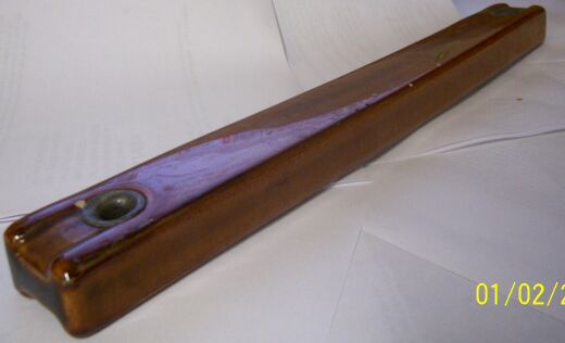 Brown ceramic insulator with reinforced holes