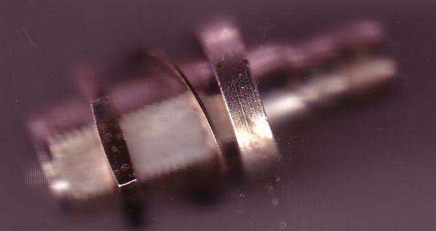 Blurred pic of bulkheaded silver airborne adaptor